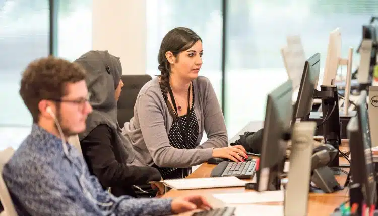 unknown persons using computer indoors